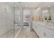 Bright bathroom with double vanity, large shower, and bedroom view at 11444 N Northfield St, Surprise, AZ 85388