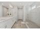 Elegant bathroom with double vanity and large walk-in shower at 11444 N Northfield St, Surprise, AZ 85388