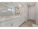 Bathroom with double vanity, large shower, and modern fixtures at 11444 N Northfield St, Surprise, AZ 85388