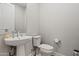 Clean and modern bathroom with pedestal sink and toilet at 11444 N Northfield St, Surprise, AZ 85388
