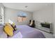 Main bedroom with large bed, chair, and mirrored dresser at 11444 N Northfield St, Surprise, AZ 85388