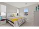 Spacious bedroom with a king-size bed and large window at 11444 N Northfield St, Surprise, AZ 85388