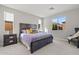 Spacious bedroom with large window and dark wood furniture at 11444 N Northfield St, Surprise, AZ 85388