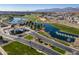 Aerial view of gated community entrance with landscaping and water features at 11444 N Northfield St, Surprise, AZ 85388