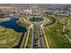 Aerial view of community entrance with circular road and water features at 11444 N Northfield St, Surprise, AZ 85388