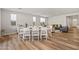 Dining area with a farmhouse style table and chairs at 11444 N Northfield St, Surprise, AZ 85388