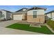 Attractive single-story home with stone facade and artificial turf at 11444 N Northfield St, Surprise, AZ 85388