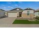 Modern house with a landscaped front yard and a white garage door at 11444 N Northfield St, Surprise, AZ 85388