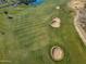 Aerial view of a manicured golf course with sand traps and water features at 11444 N Northfield St, Surprise, AZ 85388