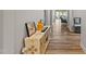 Bright entryway with wood-look floors and a console table at 11444 N Northfield St, Surprise, AZ 85388