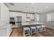 Modern kitchen with white cabinets, large island, and stainless steel appliances at 11444 N Northfield St, Surprise, AZ 85388