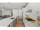 Modern kitchen with white cabinets, large island, and stainless steel appliances at 11444 N Northfield St, Surprise, AZ 85388