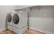 Bright laundry room with side-by-side washer and dryer at 11444 N Northfield St, Surprise, AZ 85388