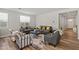 Cozy living room with gray sofas and yellow throw pillows at 11444 N Northfield St, Surprise, AZ 85388