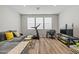Comfortable living area with a sectional sofa and home office space at 11444 N Northfield St, Surprise, AZ 85388