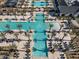 Large community pool with surrounding palm trees and lounge areas at 11444 N Northfield St, Surprise, AZ 85388