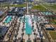 Expansive community pool with multiple areas and lounge chairs at 11444 N Northfield St, Surprise, AZ 85388