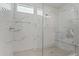 Walk-in shower with marble tile and built-in seat at 11444 N Northfield St, Surprise, AZ 85388