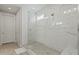 Large walk-in shower with marble tile and glass enclosure at 11444 N Northfield St, Surprise, AZ 85388