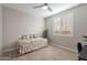 Cozy bedroom with a daybed and window with plantation shutters at 12493 E Pivot Peak --, Gold Canyon, AZ 85118