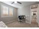 Bright bedroom with a desk and view into the kitchen at 12493 E Pivot Peak --, Gold Canyon, AZ 85118