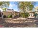 Expansive backyard with drought resistant landscaping, covered patio, and outdoor kitchen space, perfect for entertaining guests at 1449 E Mulberry St, Phoenix, AZ 85014