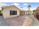Home with a brick patio, desert landscaping, and a covered patio in the backyard at 15406 W Pinchot Ct, Goodyear, AZ 85395