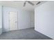 Empty bedroom featuring neutral paint, a ceiling fan and two closets at 15406 W Pinchot Ct, Goodyear, AZ 85395