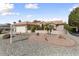 Beautiful home with a two-car garage and desert landscaping in the front yard at 15406 W Pinchot Ct, Goodyear, AZ 85395