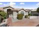 Charming single-story home with a well-maintained front yard and a welcoming entrance at 15406 W Pinchot Ct, Goodyear, AZ 85395