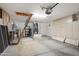 Spacious garage with built-in storage cabinets and visible mechanicals and a ladder at 15406 W Pinchot Ct, Goodyear, AZ 85395