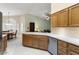 Bright kitchen featuring oak cabinets, stainless steel appliances, and an open layout at 15406 W Pinchot Ct, Goodyear, AZ 85395