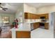 Spacious kitchen featuring stainless steel appliances and island with bar seating at 15406 W Pinchot Ct, Goodyear, AZ 85395