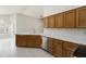 Spacious kitchen featuring wood cabinets, stainless steel appliances, and white countertops, providing ample counter space at 15406 W Pinchot Ct, Goodyear, AZ 85395