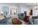 Spacious living room with comfortable seating and a large window at 15406 W Pinchot Ct, Goodyear, AZ 85395