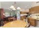Bright, open concept living space joining kitchen, dining, and living areas at 15406 W Pinchot Ct, Goodyear, AZ 85395