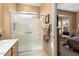Bathroom with shower and view into bedroom at 16203 W Starry Sky Dr, Surprise, AZ 85374