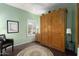 Guest bedroom with wood wall unit and ceiling fan at 16203 W Starry Sky Dr, Surprise, AZ 85374