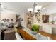 Dining area with a wood table and access to the kitchen at 16203 W Starry Sky Dr, Surprise, AZ 85374