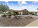 Single-story home with desert landscaping and a two-car garage at 16203 W Starry Sky Dr, Surprise, AZ 85374