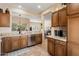 Open kitchen boasts granite counters and ample wood cabinetry at 16203 W Starry Sky Dr, Surprise, AZ 85374