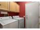 Laundry room with washer, dryer, and ample cabinet space at 16203 W Starry Sky Dr, Surprise, AZ 85374