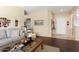Living room with hardwood floors and access to the entryway at 16203 W Starry Sky Dr, Surprise, AZ 85374