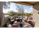 Comfortable patio furniture and a glass-top table at 16203 W Starry Sky Dr, Surprise, AZ 85374