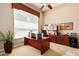 Home office with large desk, built-in cabinets and window at 1653 W Zion Pl, Chandler, AZ 85248