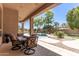 Relaxing patio with seating area overlooking the pool and landscaped backyard at 1653 W Zion Pl, Chandler, AZ 85248