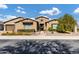 Single-story home with stone accents and a landscaped front yard at 1988 E Blackhawk Dr, Gilbert, AZ 85298