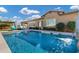 Inviting swimming pool with water feature and lounge chairs at 1988 E Blackhawk Dr, Gilbert, AZ 85298