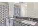 Bathroom with double vanity and shower/tub combo at 205 S Higley Rd # 189, Mesa, AZ 85206