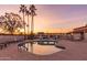 Inviting kidney-shaped community pool with lounge chairs at 205 S Higley Rd # 189, Mesa, AZ 85206